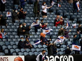 Socially distanced Edinburgh fans take in the match against Glasgow Warriors at BT Murrayfield.