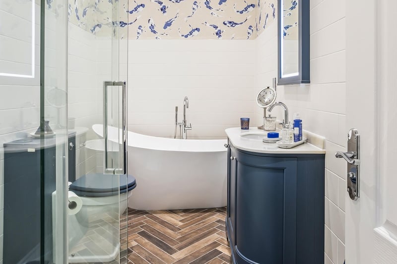 The en-suite bathroom is of a high specification and is also fitted with a four-piece suites that include a double-ended bathtub and a separate walk-in shower enclosure.
