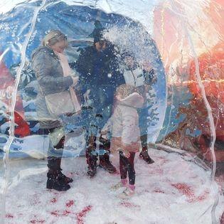 Visitors were welcomed by a walk-in, snow-filled bauble, inviting them to step into a winter wonderland