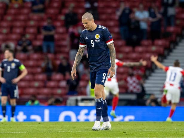 Scotland's Lyndon Dykes looks on dejectedly after a 3-1 defeat by Croatia.