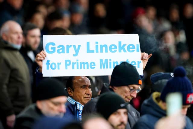 A Manchester City fan holds up a sign in support of Match of the Day presenter Gary Lineker (Picture: Zac Goodwin/PA Wire)