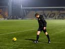 Referee Steven McLean inspects the pitch at Livingston.