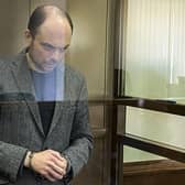 Russian opposition activist Vladimir Kara-Murza stands in a class cage at the Moscow City Court, where he was given a 25-year prison sentence (Picture: Moscow City Court via AP)