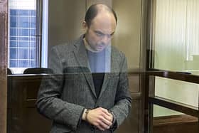 Russian opposition activist Vladimir Kara-Murza stands in a class cage at the Moscow City Court, where he was given a 25-year prison sentence (Picture: Moscow City Court via AP)