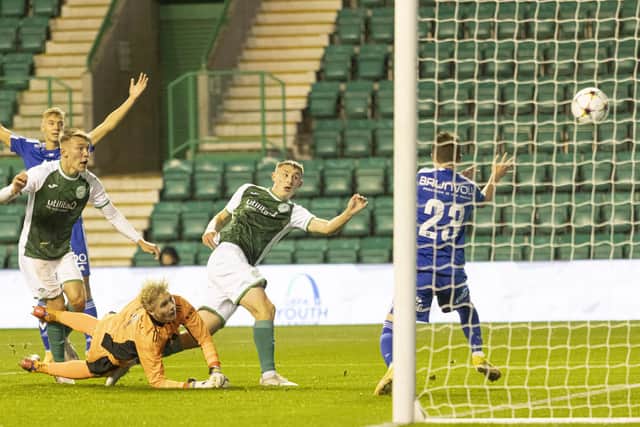 Jacob Blaney, centre, fires home the opening goal at Easter Road. Picture: Cameron Allan