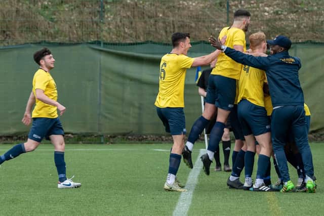 Heriott-Watt celebrate their play-off success which means they will play in the top division of British University men's football