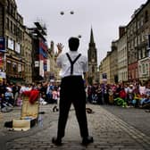 This street performer attracted a large crowd on the High Street, Edinburgh, during the Fringe in 2004.
