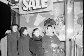 Wrapped up against the early morning cold these intrepid bargain hunters are first in the queue at Blyth's department store in Earl Grey Street, Edinburgh for the start of the January sale, 1950s.