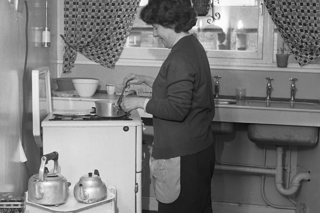 Mrs Mary Eves can be seen here in the kitchen of her new home at Cables Wynd in April 1966