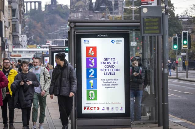 Scottish Government public information signs along Edinburgh's Princes Street.