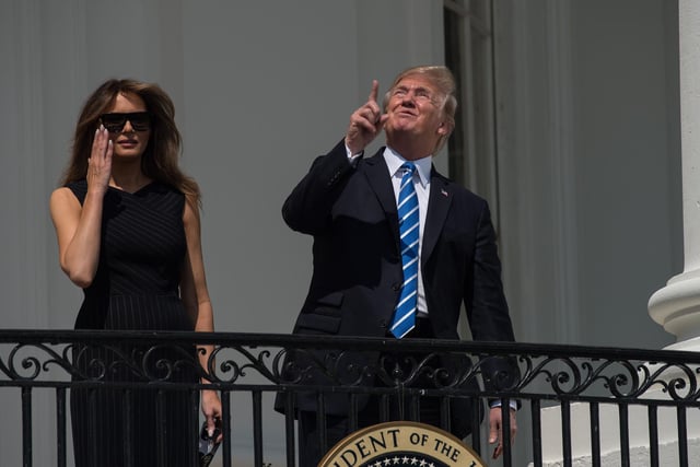 US President Donald Trump with First Lady Melania Trump on the balcony of the White House to look at the solar eclipse.  "Everything will be fine Mr. President, so long as you don't look directly at the su....."