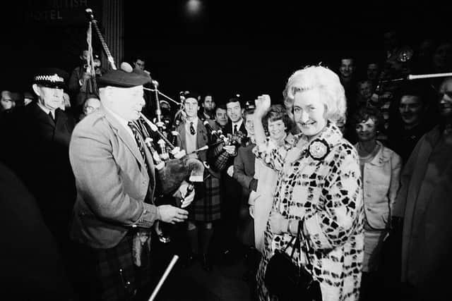 Winnie Ewing (right), the newly-elected Scottish National Party (SNP) Member of Parliament for Hamilton is welcomed by supporters, including two highland bagpipers, as she arrives in London to take up her seat in the House of Commons in November 1967 (Picture: Terry Fincher/Daily Express/Hulton Archive/Getty Images)