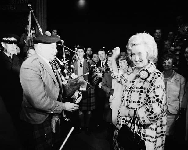 Winnie Ewing (right), the newly-elected Scottish National Party (SNP) Member of Parliament for Hamilton is welcomed by supporters, including two highland bagpipers, as she arrives in London to take up her seat in the House of Commons in November 1967 (Picture: Terry Fincher/Daily Express/Hulton Archive/Getty Images)