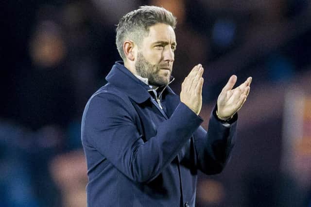 Lee Johnson applauds the Hibs fans at Rugby Park