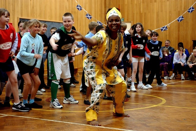 Members of West African drum group from Ghana showing Dalry Primary School pupils their dances and drumming, in August, 2012.