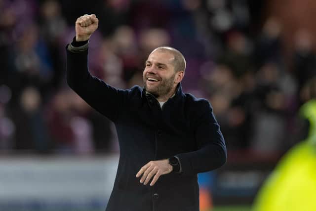 Hearts manager Robbie Neilson celebrating at full-time after his team beat Hibs 3-0.