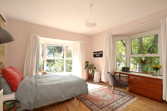 This is the second bedroom, with bay windows on two sides offering views of leafy Nether Edge.