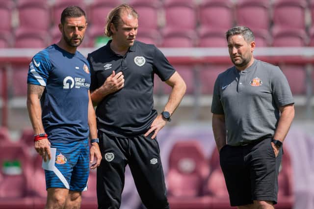 Hearts' manager Robbie Neilson with former team-mates Jamie McAllister (left) and Sunderland manager Lee Johnson. Picture: SNS