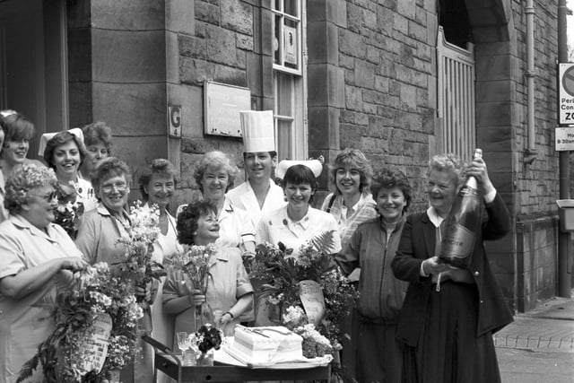 Nurses and staff from Bruntsfield Hospital in Whitehouse Loan Edinburgh celebrate the hospital's centenary with champagne and flowers in June 1985.