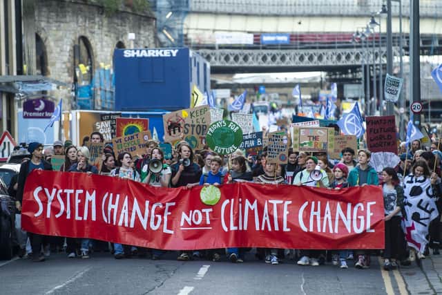 A climate change protest making its way along East Market Street in Edinburgh