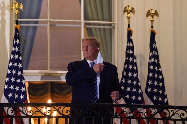 President Donald Trump takes off his facemask as he arrives at the White House upon his return from Walter Reed Medical Center, where he underwent treatment for Covid-19. 
 The White House released a video of Trump returning to the White House in triumphant form.  He later went on to declare that he was now 'indestructable'
