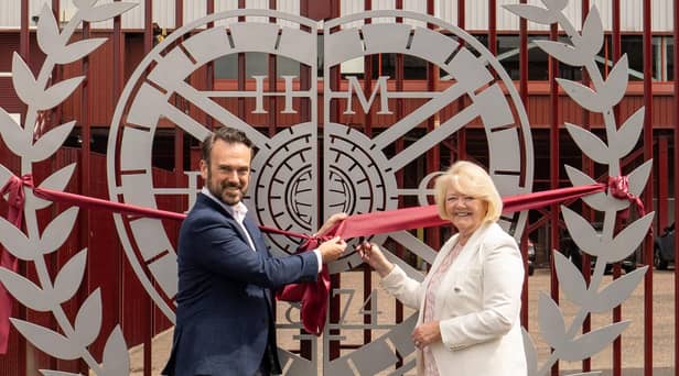 Foundation of Hearts chairman Gerry Mallon and Hearts chairwoman Ann Budge unveil a specially designed gate at Tynecastle marking the club's 150-year history. Picture: Heart of Midlothian Football Club