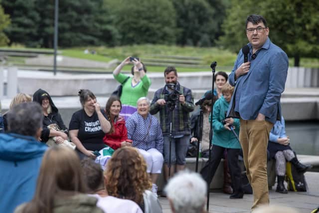 Irish comedy writer Graham Linehan performs his Edinburgh Fringe Festival show outside the Scottish Parliament. Picture: SWNS