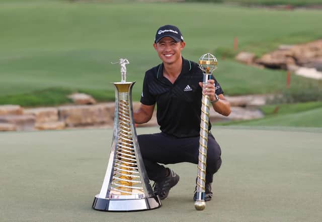 Collin Morikawa celebrates with the Race To Dubai Trophy after clinching the title in style by winning the DP World Tour Championship. Picture: Andrew Redington/Getty Images.