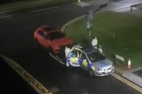 Forensics officers were captured on video at the scene in the early hours of Wednesday morning.