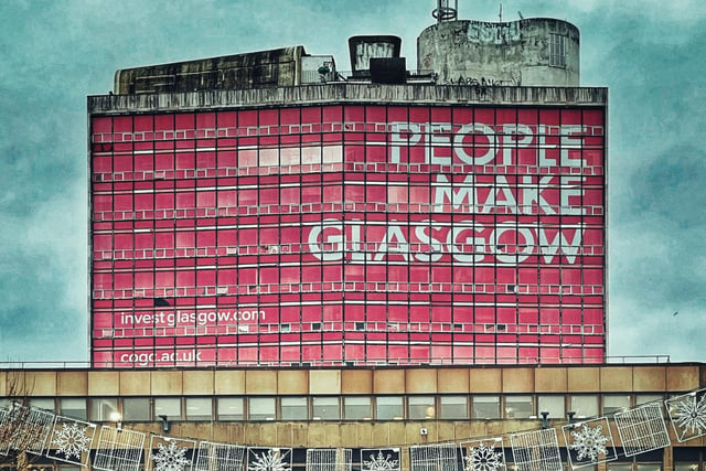 The former City of Glasgow College building on Glasgow's North Hanover Street is considered an eye-sore. The B-listed building does not blend into the skyline, due to its bright pink 'People Make Glasgow' sign.