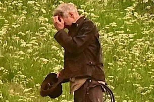 Harrison Ford, as Indiana Jones, looks as though he's fighting Borders midges in his new film, shooting at Leaderfoot Viaduct last night. Picture: Neil Renton.