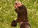 Harrison Ford, as Indiana Jones, looks as though he's fighting Borders midges in his new film, shooting at Leaderfoot Viaduct last night. Picture: Neil Renton.