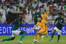 Martin Boyle in possession for Australia during the 1-0 defeat to Saudi Arabia as Nathaniel Atkinson watches on. Picture: Getty