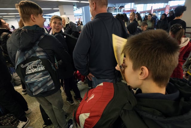 The 52 Ukrainian orphans were finally able to secure flights and head to the airport on Wednesday after all paperwork was completed. Here they are pictured waiting for their flight to the UK at Chopin Airport in Warsaw, Poland. 
Picture:  AP Photo/Czarek Sokolowski