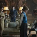 This image released by Netflix shows Olivia Colman, from left, Josh O'Connor and Emma Corrin in a scene from "The Crown." Season four premieres on Sunday, Nov. 15. (Des Willie/Netflix via AP)