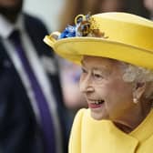 Queen Elizabeth II dressed in yellow at Paddington station in London, to mark the completion of London's Crossrail project.