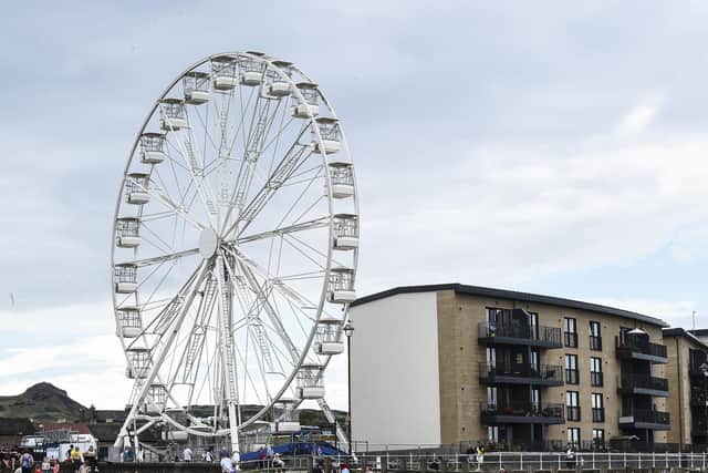 Operators of a Ferris wheel which has been erected at Portobello have expressed their anger at Edinburgh City Council and the Scottish Government after they were granted a licence to operate - before then being told they could not due to the fact it is classed as a funfair. (Credit: Lisa Fergson)