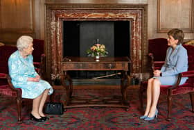 Britain's Queen Elizabeth II speaks with Scotland's First Minister Nicola Sturgeon during an audience at the Palace of Holyroodhouse in Edinburgh on June 29, 2021. (Credit: Jane Barlow/Pool/AFP)