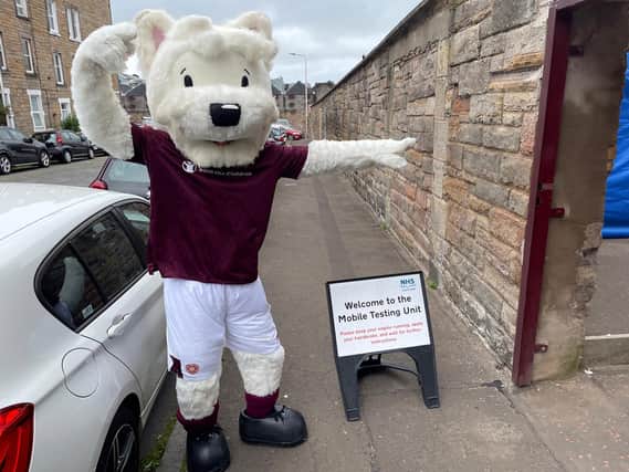 Hearts mascot Jock points the way to the testing centre at Tyencastle