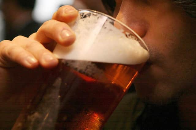 A man drinking a pint of beer. Picture: Johnny Green/PA Wire