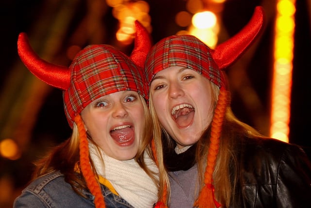 Two locals wore viking style tartans hats as they posed for the camera on New Year's Eve.