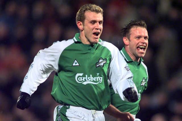 Franck Sauzee celebrates alongside Hibs team-mate John Hughes after scoring in a 3-0 win at Tynecastle. Picture: SNS