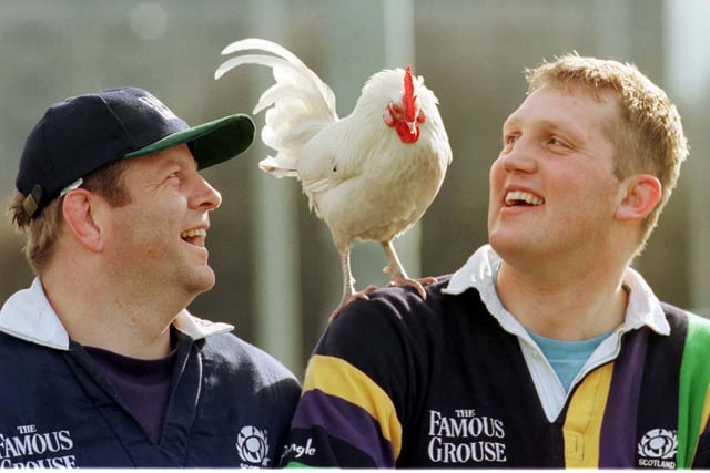 Doddie Weir, right, and former Scotland team-mate Damian Cronin pose with a cockerel ahead of a Five Nations game against France in 1998. (Chris Bacon/PA)