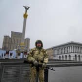 An armed man stands at the Independent Square (Maidan) in the center of Kyiv, Ukraine, Wednesday, March 2, 2022. Picture; Efrem Lukatsky