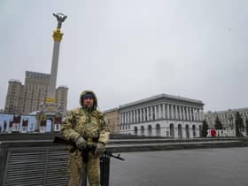 An armed man stands at the Independent Square (Maidan) in the center of Kyiv, Ukraine, Wednesday, March 2, 2022. Picture; Efrem Lukatsky