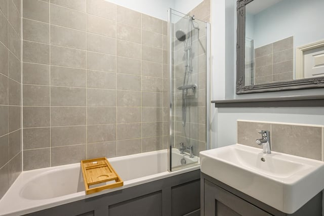 The bathroom features a thermostatic shower, bath and glass shower screen
Photo: Neilsons and Planography