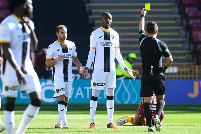 Livingston's Dylan Bahamboula receives his second yellow card against Motherwell at Fir Park. Picture: Ross MacDonald / SNS