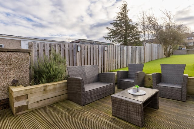 Sit out in the sun in the patio area of the three-tiered south-facing back garden.