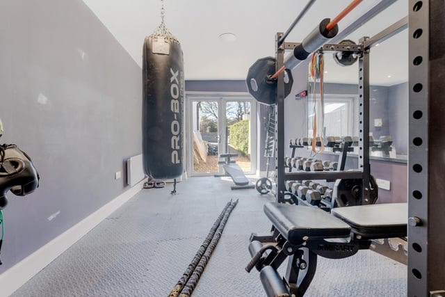 The former garage has been transformed into a superb home gym, that could easily be used as a home office, depending on the buyer’s requirements.