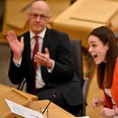 SNP leadership candidate Kate Forbes, applauded by her maternity leave stand-in as Finance Secretary, John Swinney (Picture: Jeff J Mitchell/Getty Images)
